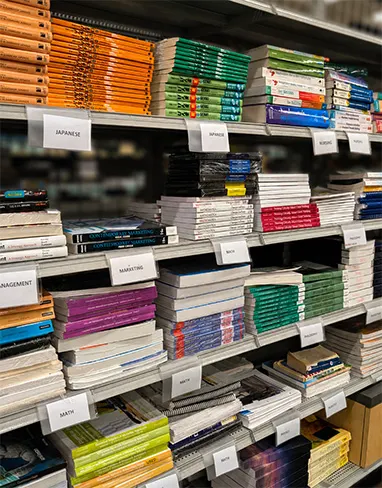 textbooks stacked on store shelf